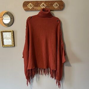 Chic Terracotta Turtleneck Sweater with Fringe